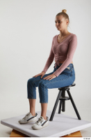  Kate Jones  1 blue jeans casual dressed pink long sleeve t shirt sitting white sneakers whole body 0008.jpg
